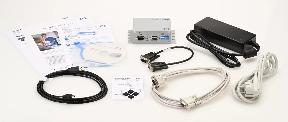 Scope of delivery for the C-863.12: Controller with power adapter and power cord, communication cables, adhesive feet, software CD, and user documentation
